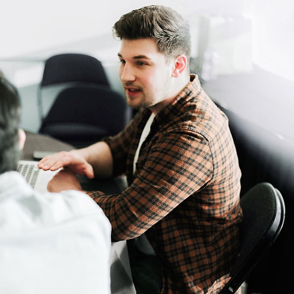 Man talking with colleague